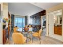 Elegant dining area with a round glass-top table and four mustard-colored chairs at 125 E Harmon Ave # 3214, Las Vegas, NV 89109