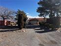 Gravel driveway leading to a carport and house at 2891 Oakleaf Ave, Pahrump, NV 89048