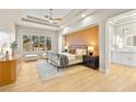 Bright bedroom with a metal bed frame and wood accent wall at 3016 Darby Falls Dr, Las Vegas, NV 89134