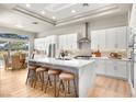 Modern kitchen featuring white cabinets and a large island at 3016 Darby Falls Dr, Las Vegas, NV 89134