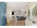 Bright and airy entryway with view into living room and fireplace at 3110 Scotts Valley Dr, Henderson, NV 89052