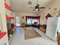 Spacious living room with a fireplace and tile flooring at 3830 Passionfruit St, North Las Vegas, NV 89032