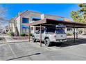 Exterior view of condo with assigned covered parking and desert landscaping at 4241 Gannet Cir # 205, Las Vegas, NV 89103