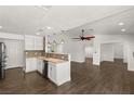 Modern white kitchen with granite countertops and mosaic backsplash at 4840 Conough Ln, Las Vegas, NV 89149