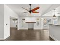 Bright living room with dark tile floors and a ceiling fan at 4840 Conough Ln, Las Vegas, NV 89149