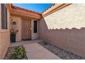 Inviting entryway with a security door and well-maintained landscaping at 9037 Grayling Dr, Las Vegas, NV 89134