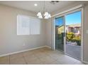 Bright dining area with access to a balcony at 9328 Black Wolf Ave, Las Vegas, NV 89178