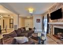 Open living room with sectional sofa, fireplace and hardwood floors at 1409 E St Louis Ave # A, Las Vegas, NV 89104