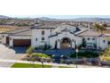 Luxury home with a large yard, impressive architecture, and mountain views at 1616 Villa Rica Dr, Henderson, NV 89052