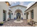 Inviting courtyard entry with fountain and seating area at 1616 Villa Rica Dr, Henderson, NV 89052