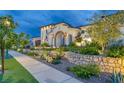 Luxury home with beautifully landscaped yard and stone retaining walls at 1616 Villa Rica Dr, Henderson, NV 89052