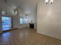 Bright living room with high ceilings, ample natural light, and a classic fireplace at 2206 Farmouth Cir, North Las Vegas, NV 89032