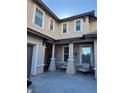 Two-story home with front porch and seating area at 2621 Slide Canyon Ave, North Las Vegas, NV 89081