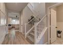 Bright entryway with hardwood floors and a staircase at 319 Cooper Hawk Ct, Las Vegas, NV 89138