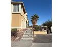 View of the exterior of a home showcasing desert landscaping and trees at 3891 Terrazzo Ave, Las Vegas, NV 89115