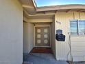 Front entrance with double doors and a small covered porch at 4413 Buckeye Ave, Las Vegas, NV 89102