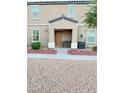 Two-story house with a front porch and landscaping at 5197 Silica Chalk Ave, Las Vegas, NV 89115