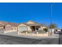 Single-story house with a two-car garage and a neat front yard at 7300 Mountain Thicket St, Las Vegas, NV 89131