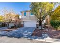 Two-story house with attached garage and mature trees at 7640 Houston Peak St, Las Vegas, NV 89166