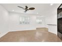 Spacious living room with wood-look floors and ceiling fan at 9139 Badby Ave, Las Vegas, NV 89148