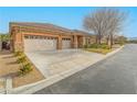 House exterior with driveway and two-car garage at 10840 Villa Torre St, Las Vegas, NV 89141