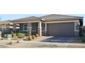 Modern home with landscaping and a welcoming front porch at 1170 N Water St, Henderson, NV 89011