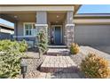 Brick walkway leading to a charming front door at 1170 N Water St, Henderson, NV 89011