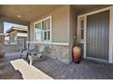 Covered porch with seating and a large pot at 1170 N Water St, Henderson, NV 89011