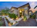 Home's exterior showcases beautiful landscaping and architectural details at 1343 Panini Dr, Henderson, NV 89052