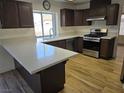 Modern kitchen with stainless steel appliances and L-shaped counter at 1732 Monte Alban Dr, North Las Vegas, NV 89031