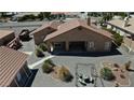 Backyard view showing a patio, garden, and gravel landscaping at 2221 E Winery Rd, Pahrump, NV 89048