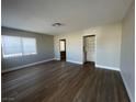 Spacious living room with wood-look flooring and neutral walls at 2410 Poplar Ave, Las Vegas, NV 89101