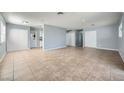 Spacious living room with tile floors and neutral walls at 2620 Shiloh Way, North Las Vegas, NV 89030