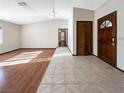 Bright and airy living room with hardwood floors and tile entryway at 311 E Desert Rose Dr, Henderson, NV 89015