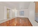 Living room with hardwood floors and neutral walls at 33 Gentilly Lace Ave, Henderson, NV 89002