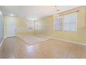 Spacious living area featuring large windows, recessed lighting, and tiled flooring at 3517 Colby Creek Ave, North Las Vegas, NV 89081