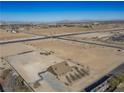 Aerial view showcasing home's setting and surrounding desert landscape at 3900 W Landberg Ave, Las Vegas, NV 89141