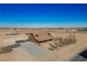 Aerial view of log home on spacious lot with desert landscape at 3900 W Landberg Ave, Las Vegas, NV 89141