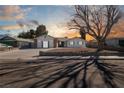 Single story home with landscaped yard and driveway at 3939 Springhill Ave, Las Vegas, NV 89121