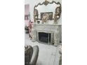 Close-up of an ornate fireplace with a decorative mirror and lion accents at 4030 Allyson Rae St, North Las Vegas, NV 89032