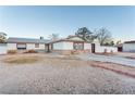 Single story home with a long driveway and desert landscaping at 4300 San Mateo St, North Las Vegas, NV 89032