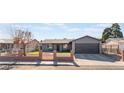 House exterior featuring a gray color scheme and a landscaped front yard at 4825 Greencreek Dr, Las Vegas, NV 89110