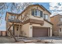 Two-story house with brown garage door and landscaped yard at 4944 Guysborough St, Las Vegas, NV 89148