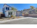 Exterior view of a well-maintained two-story home with low-maintenance landscaping and a modern design at 6 Lilla Rosa St, Henderson, NV 89011