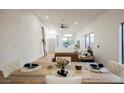 Open concept dining room with rustic wood table, seating, and natural light at 6304 Tanzanite Ave, Las Vegas, NV 89130