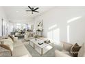 Virtually staged living room with comfortable seating and a large coffee table at 6304 Tanzanite Ave, Las Vegas, NV 89130