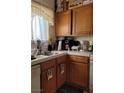 Cozy kitchen featuring wood cabinets and modern appliances at 637 Bay Bridge Dr, North Las Vegas, NV 89032