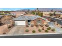 Single-story house with a landscaped yard and driveway at 6692 Radiant Red Ave, Las Vegas, NV 89130