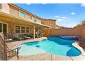 Inviting backyard oasis featuring a sparkling pool and spa at 685 Sea Star St, Henderson, NV 89002