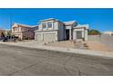 Two-story house with three-car garage and street view at 7900 Holly Knoll Ave, Las Vegas, NV 89129